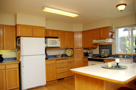 Colorful platters and candles add a lot to bring out the blue tile back splash.