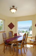 The artwork and matching runner help bring color to the dining room.